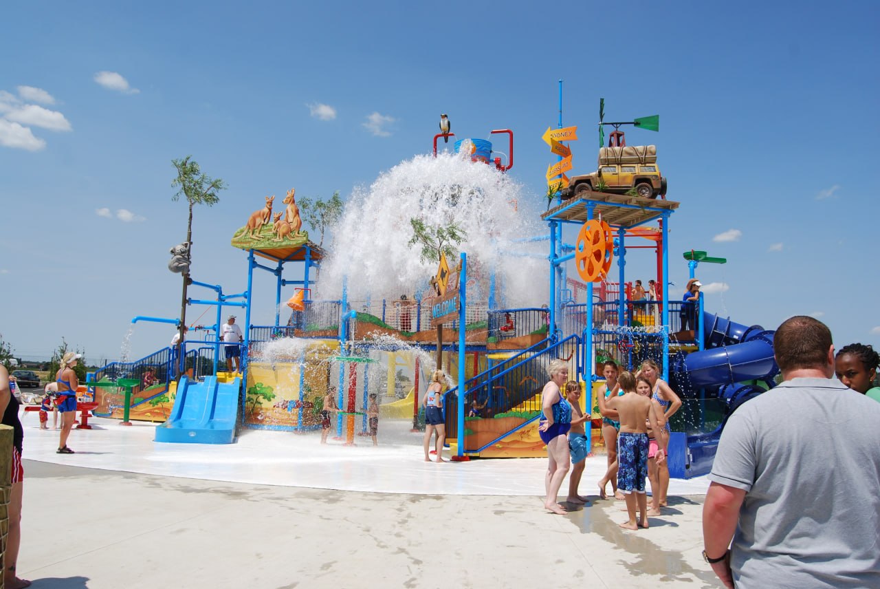 Jungle-themed water play structure with slides